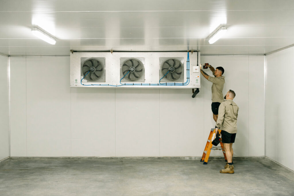 Commercial coolroom with a three-fan evaporator unit being installed